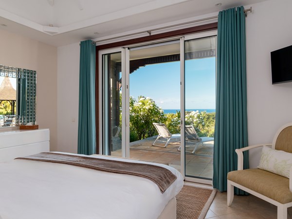 Une chambre de la 4 Bedroom Pool Villa