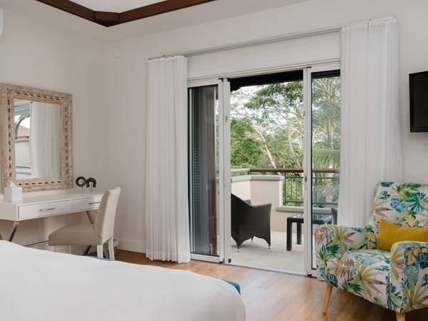 Une chambre de la 3 Bedroom Pool Villa