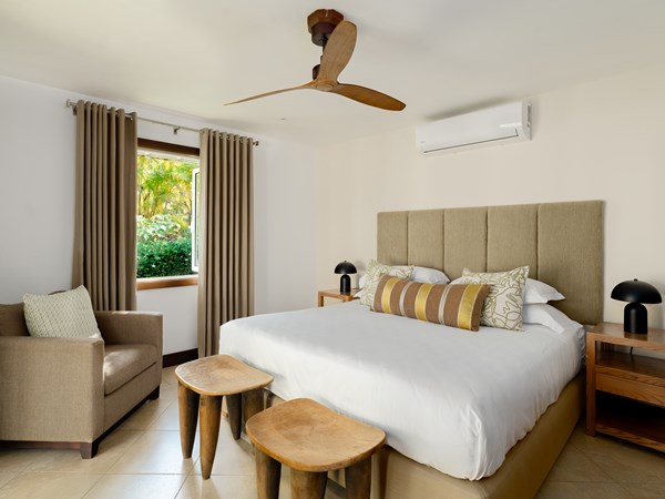 Une chambre de la 4 Bedroom Pool Villa
